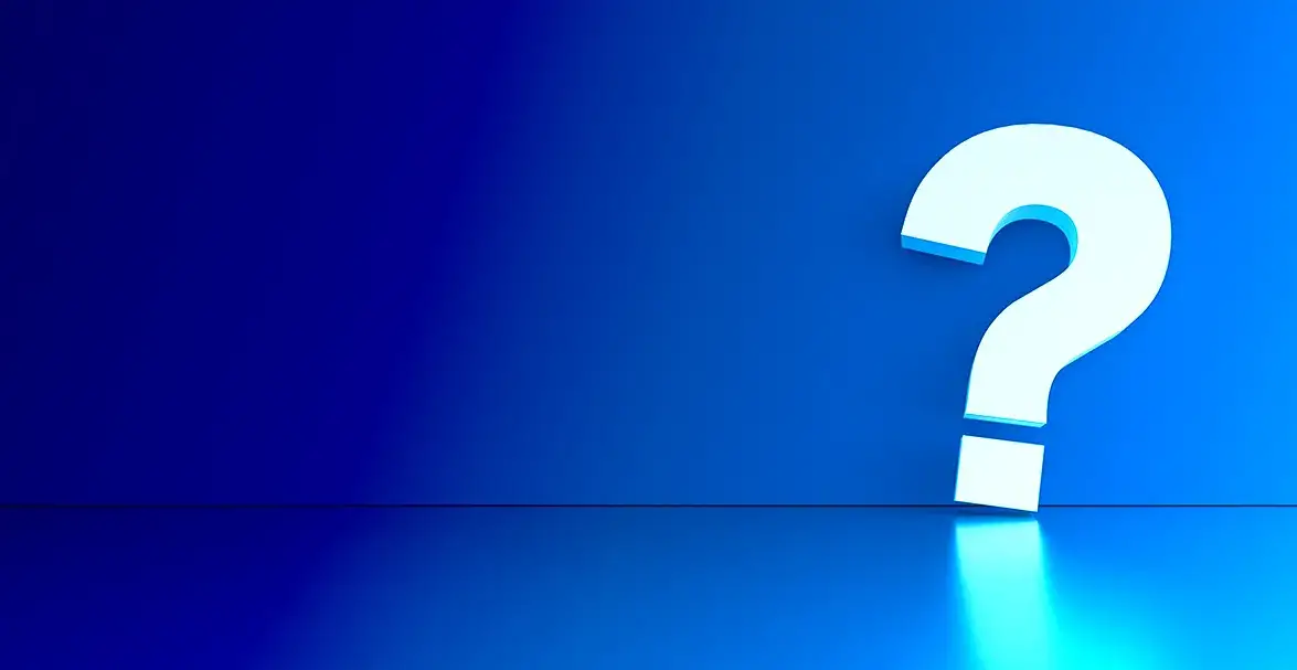 Blue wall with a neon question mark